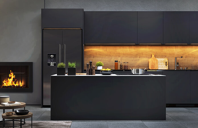 Set of black kitchen cabinets and kitchen island in a UK house